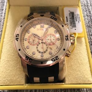 Gold Invicta watch black silicone band